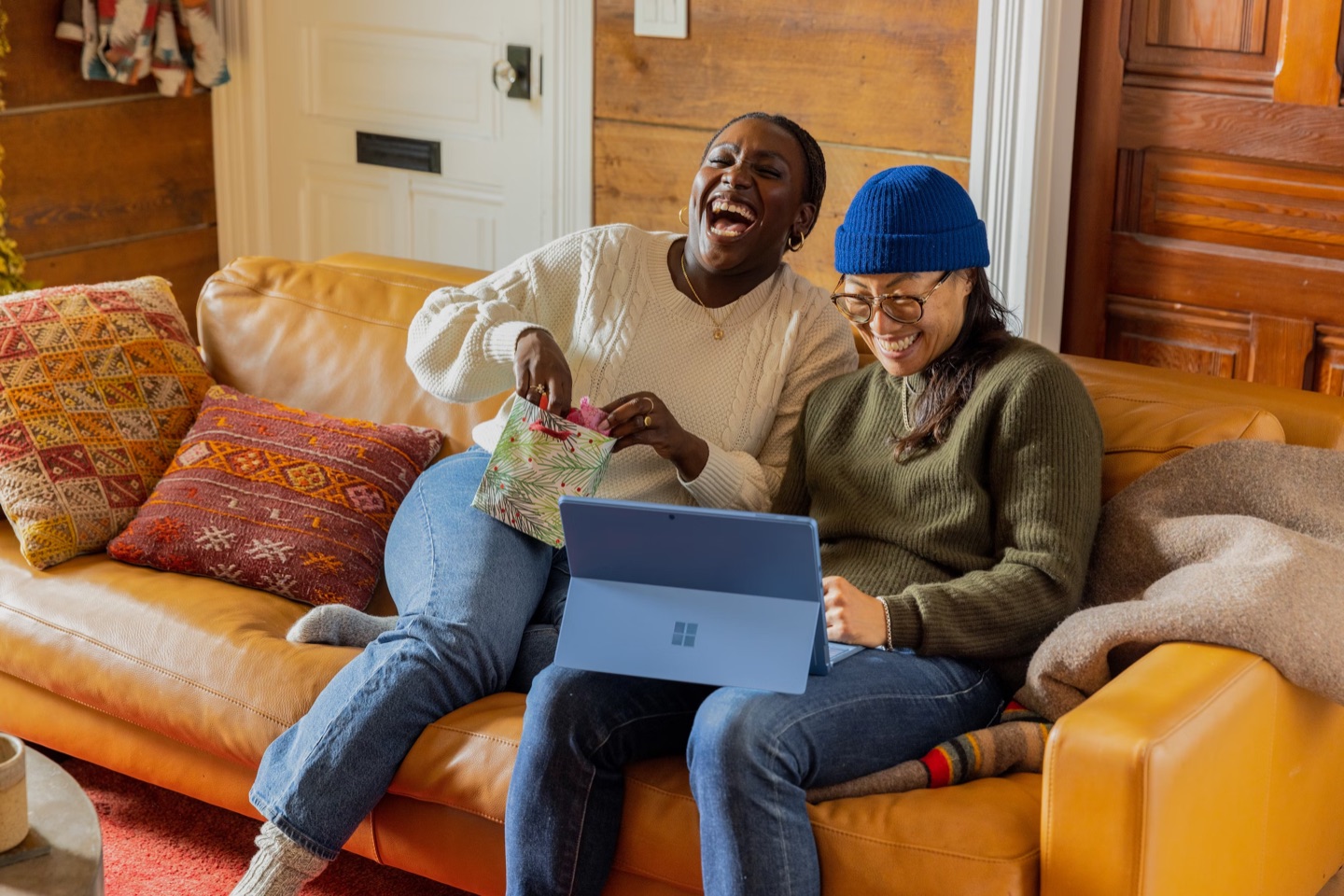 Two people planning a trip together on a laptop